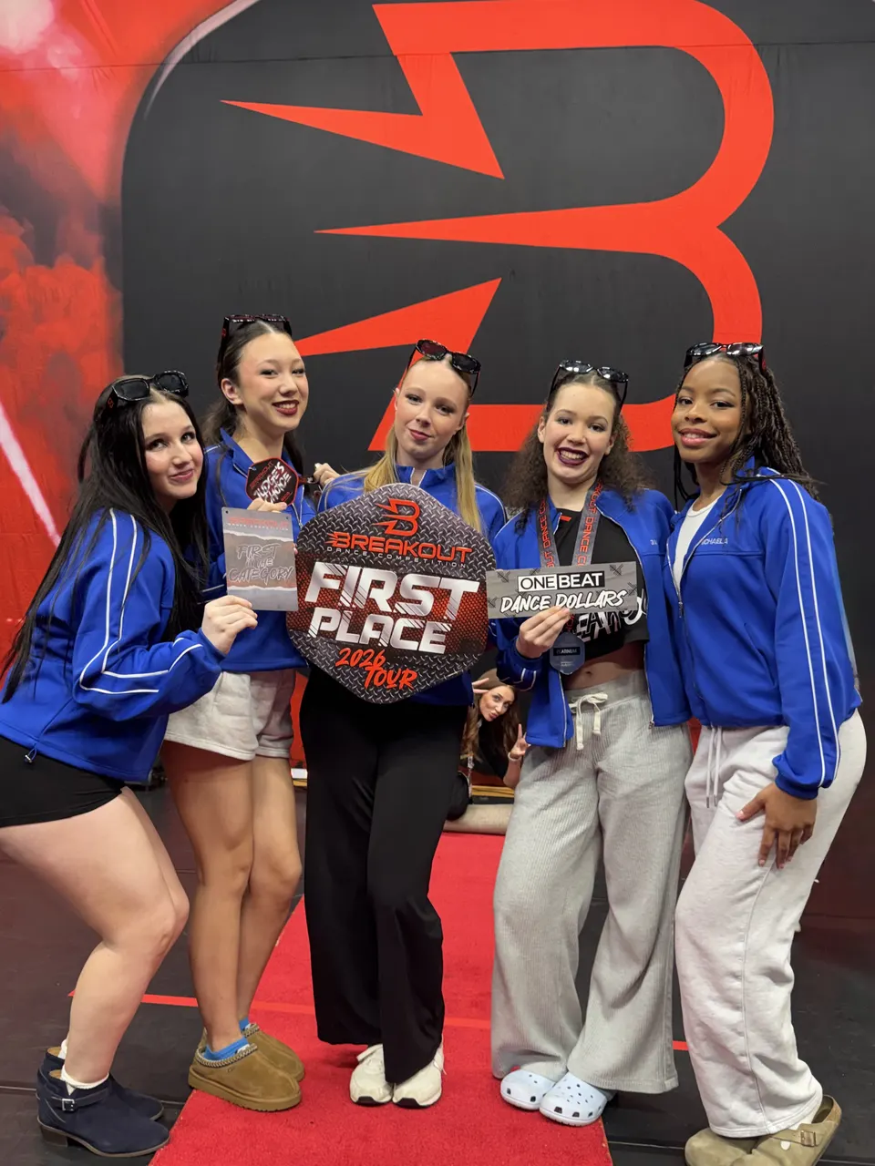 Dancers holding a first place award